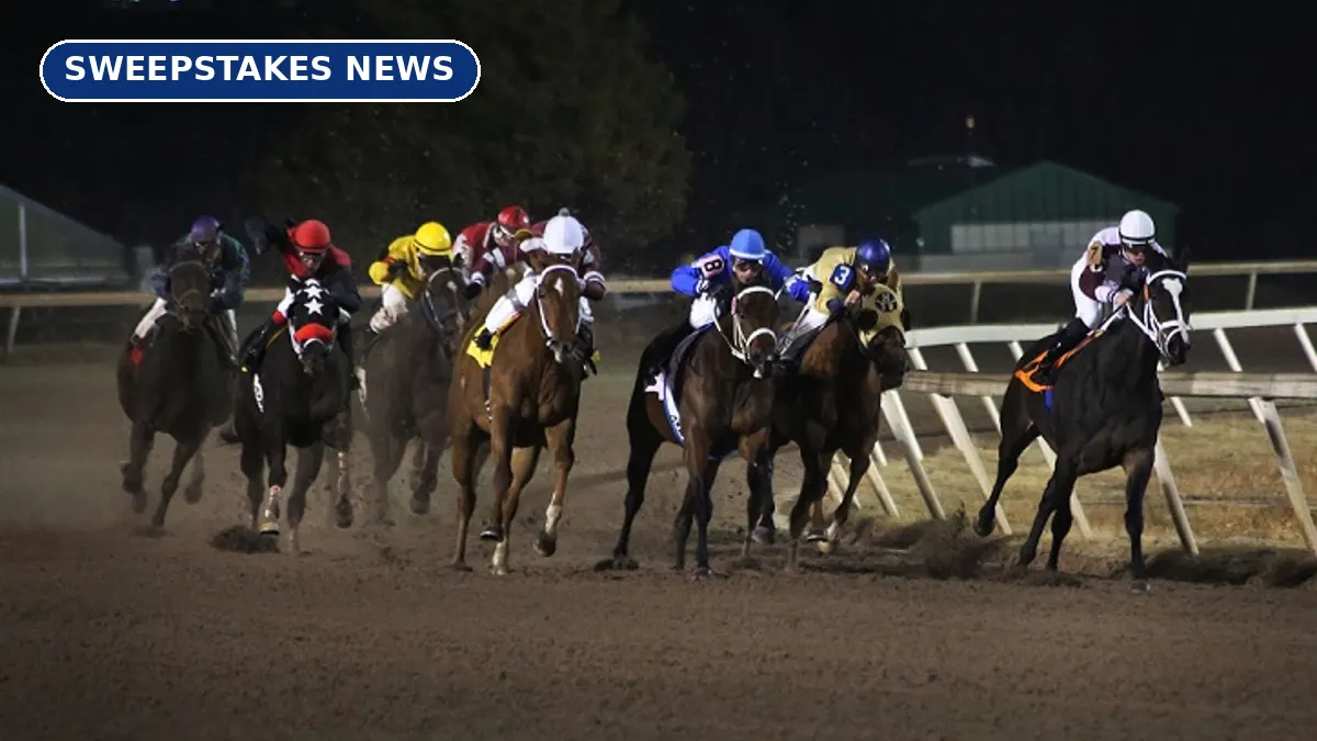 Thoroughbred horses and jockeys racing around a dirt track at night