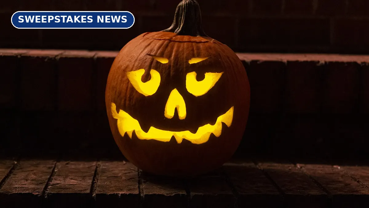 A carved jack-o’-lantern glowing on brick steps at night